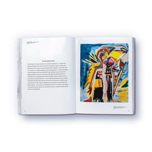 Load image into Gallery viewer, A colorful, abstract artwork featured on a page of a paperback book titled 'The elephant never forgets' by Danny Minnick.