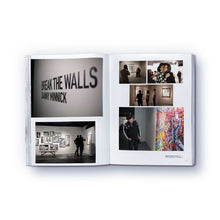 Load image into Gallery viewer, A colorful, abstract artwork at a gallery featured on a page of a paperback book titled 'The elephant never forgets' by Danny Minnick.
